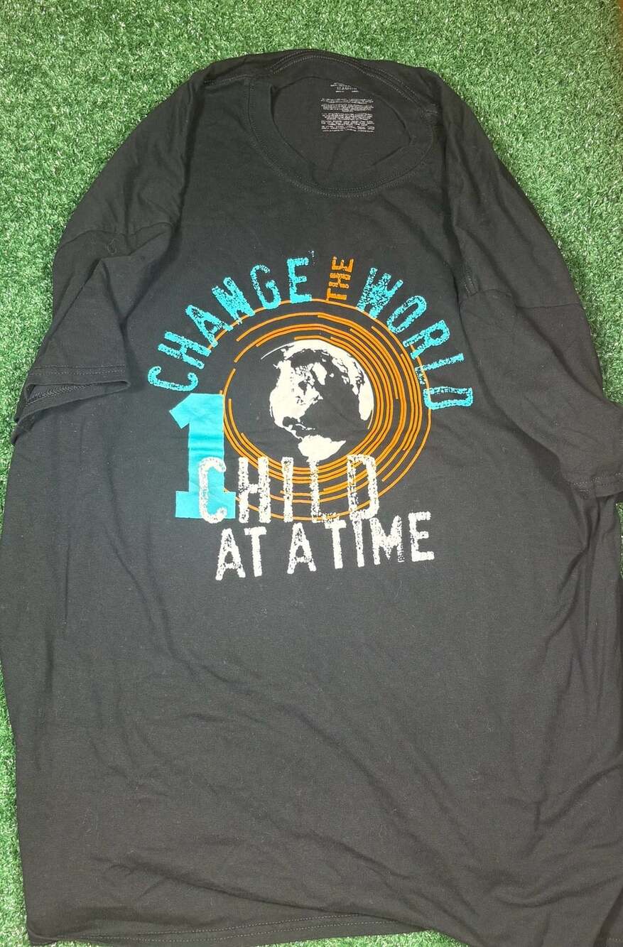 Graphic T-Shirt Change The World 1 Child At A Time Black
